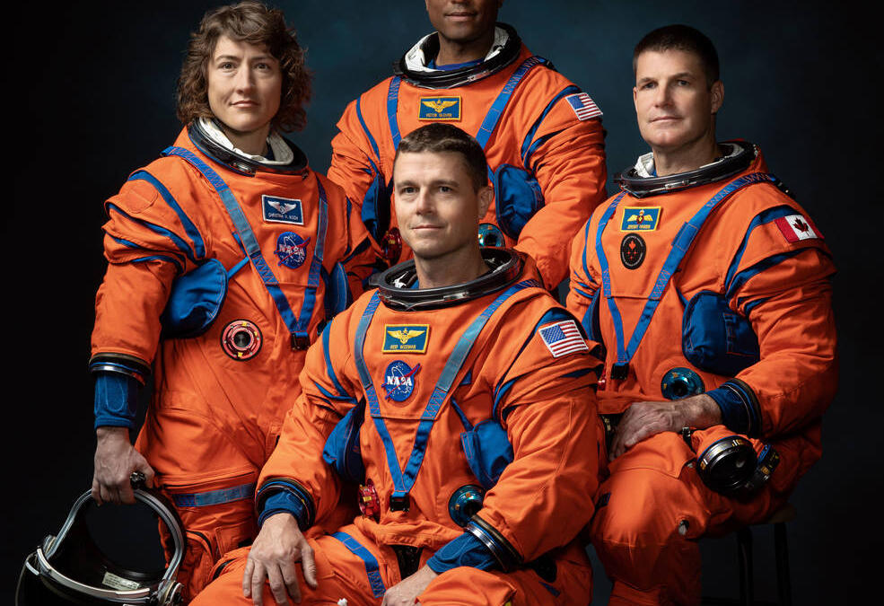 artemis 2 crew members NASA astronauts Christina Hammock Koch, Reid Wiseman (seated), Victor Glover, and Canadian Space Agency astronaut Jeremy Hansen left to right