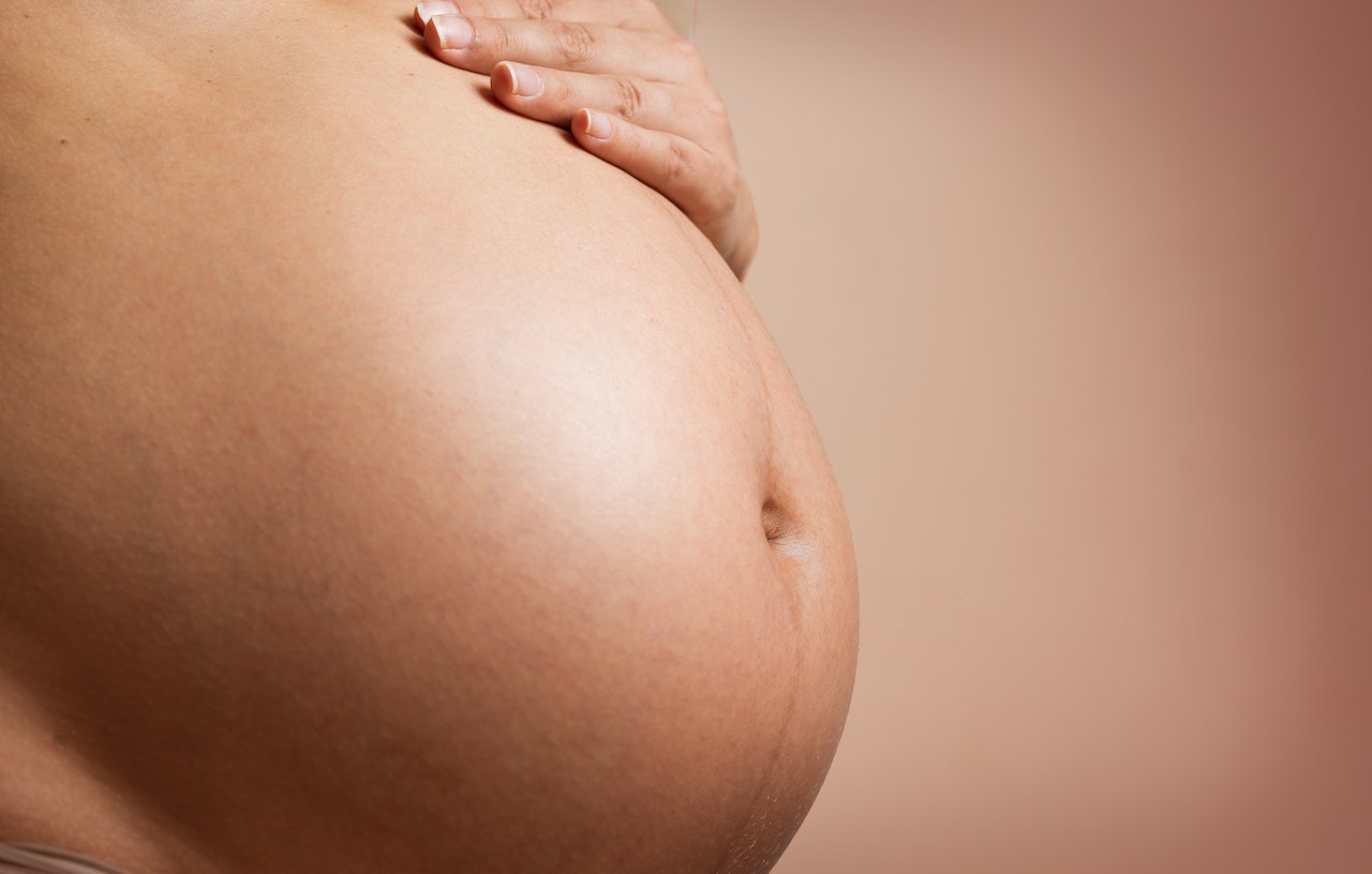 close up of a pregnant woman's womb