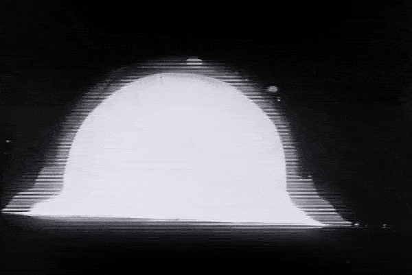 mushroom like cloud of the first nuclear explosion named Trinity test
