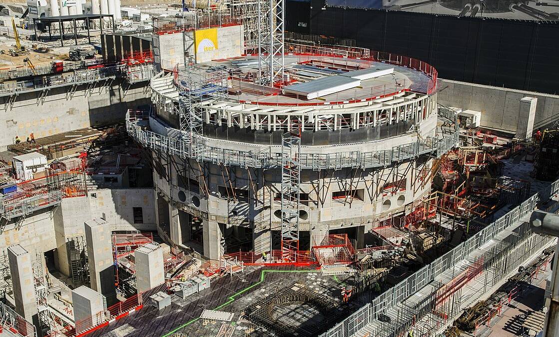 Construction site of a cylindrical building, the fusion reactor site of The International Thermonuclear Experimental Reactor (ITER)